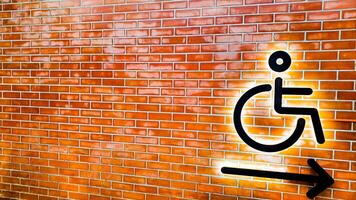 Red bricks lined up symbolizing disabled people in wheelchairs photo