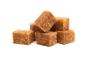 Brown sugr cubes on white photo