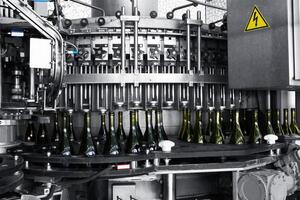 Wine bottles on industrial machine photo