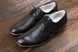Black man shoes on wood photo