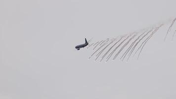 A P-8A Poseidon performs a flare drop maneuver in overcast skies at the Avalon Airshow in Geelong, Australia video