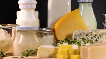 Various dairy items arranged on a black background video