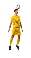 A man in a yellow soccer uniform is balancing a soccer ball photo