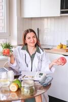 A nutritionist demonstrates a donut as an example of unhealthy food and its effect on weight and health. The concept of wellness and health care. photo