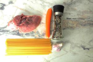 meat with pasta Layout of products for pasta bolognese, top view. Background for the recipe photo