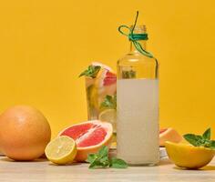 Citrus drink with mint and fruits photo