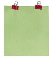 Sheet of green paper attached with two red paper clips binders, isolated background photo