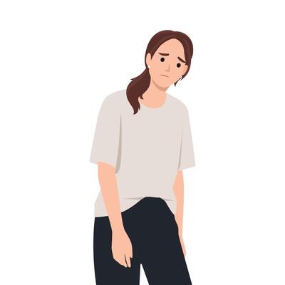 Woman with a slouched posture and a sad expression, wearing a loose beige shirt and dark pants.