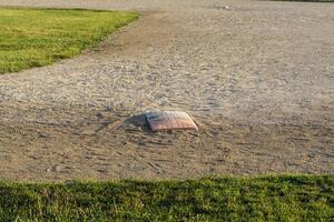 close up of first base on diamond two in the park photo