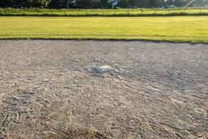 close up of second base on diamond two in the park photo