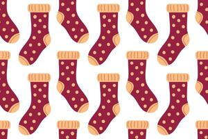 Seamless pattern with burgundy socks and polka dots. Soft and warm design for textile and cozy fall illustrations. vector