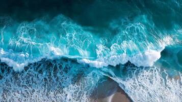 Aerial View of Dynamic Ocean Waves with Turquoise and White Foam Creating Abstract Patterns1 photo