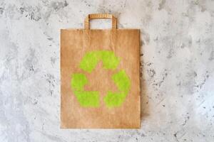 blank eco brown paper bag on light background. Mock up photo