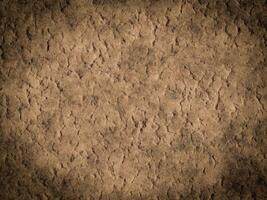 Rough cement texture with noticeable cracks and uneven surface patterns. photo