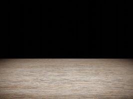 Softly illuminated wood table showcasing its texture, contrasted by a deep black background. photo