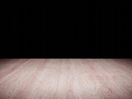 Dark wooden table surface with intricate grain pattern set against a black background. photo