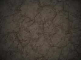 Dark marble texture with intricate veining and high contrast. photo