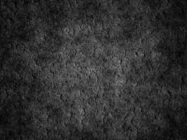 Close-up of rough cement texture with irregularities and aged patterns. photo