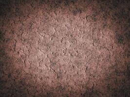 Weathered rough cement texture with uneven surface patterns and cracks. photo