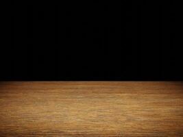 Wooden table surface with smooth texture against a black background. photo