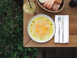 Citrus dish with bread and drinks photo