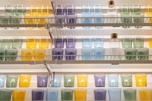 Colorful glasses and bottles arranged on shelves in a pantry setting photo