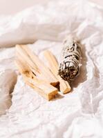 White sage, Palo Santo sticks a light paper background. A set of incense for fumigation photo