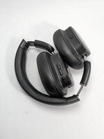 Black Folded Headphones on White Background Showing Details of the Design photo
