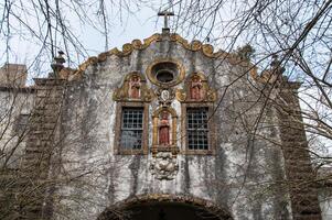 Facade of an abandoned monastery in ruins photo