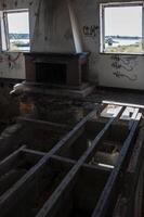Detail of a view of a house in ruins, where the floor has disappeared photo
