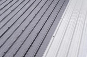 Corrugated metal roof sheet provides strong protective covering creating durable surface designed for long lasting construction giving feeling of security and structure photo