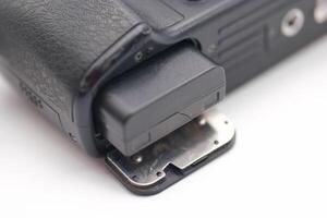 Close up view of a camera battery compartment showing detailed components and structure photo