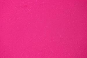 Bright pink sparkly surface ideal for creative arts and crafts projects during daytime activities photo