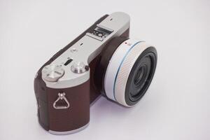 Compact digital camera featuring sleek design and unique color combination, suitable for photography enthusiasts and everyday users alike photo