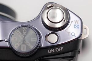Close up view of a camera control panel with buttons and settings in a studio setting during daylight hours photo