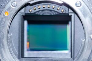 Close view of a camera sensor revealing intricate details and internal components in a controlled lighting environment photo