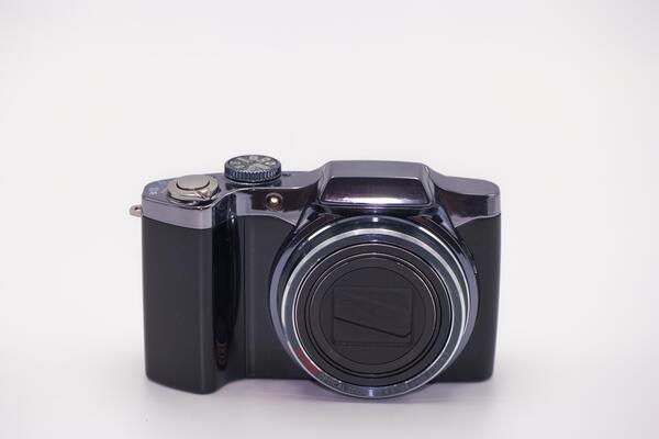 Compact digital camera with sleek design, ready for capturing memorable moments in various settings