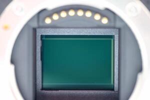 Detailed close up view of a camera sensor showing electronic components and light gathering area for photography enthusiasts photo