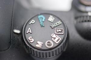 Camera settings dial showcasing various modes for photography in close up view photo
