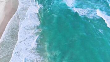 Aerial view of ocean waves hitting the shore video