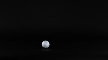 Golf ball moving across a dark background video