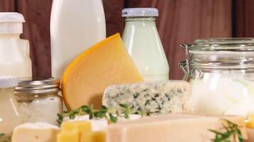 Various dairy items displayed on a wooden surface video