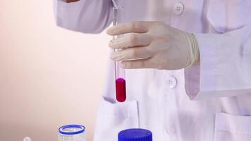 Scientist conducts chemical reaction in laboratory setting video