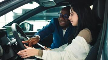 The concept of a confidential dialogue between the buyer and the consultant, the process of making a decision to buy a car. Consultation with the seller when buying or renting a new car. photo
