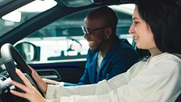A car dealer advises a customer on the purchase or lease of a new car. The concept of an expensive purchase or lease of a car photo