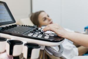 An ultrasound machine when a health care professional performs a scan. Medical imaging and diagnostic technology concept. photo
