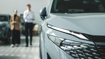 Consultation with the seller when buying a new car. The concept of a confidential dialogue between the buyer and the consultant, the process of making a decision to buy a car. photo