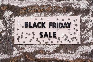 Abstract background of silver sequins with the inscription BLACK FRIDAY SALE. photo