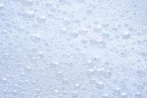 Thick soap foam with bubbles. photo
