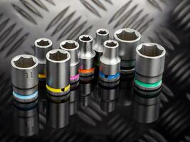 Set of Color Coded Socket Wrenches on Black Surface photo